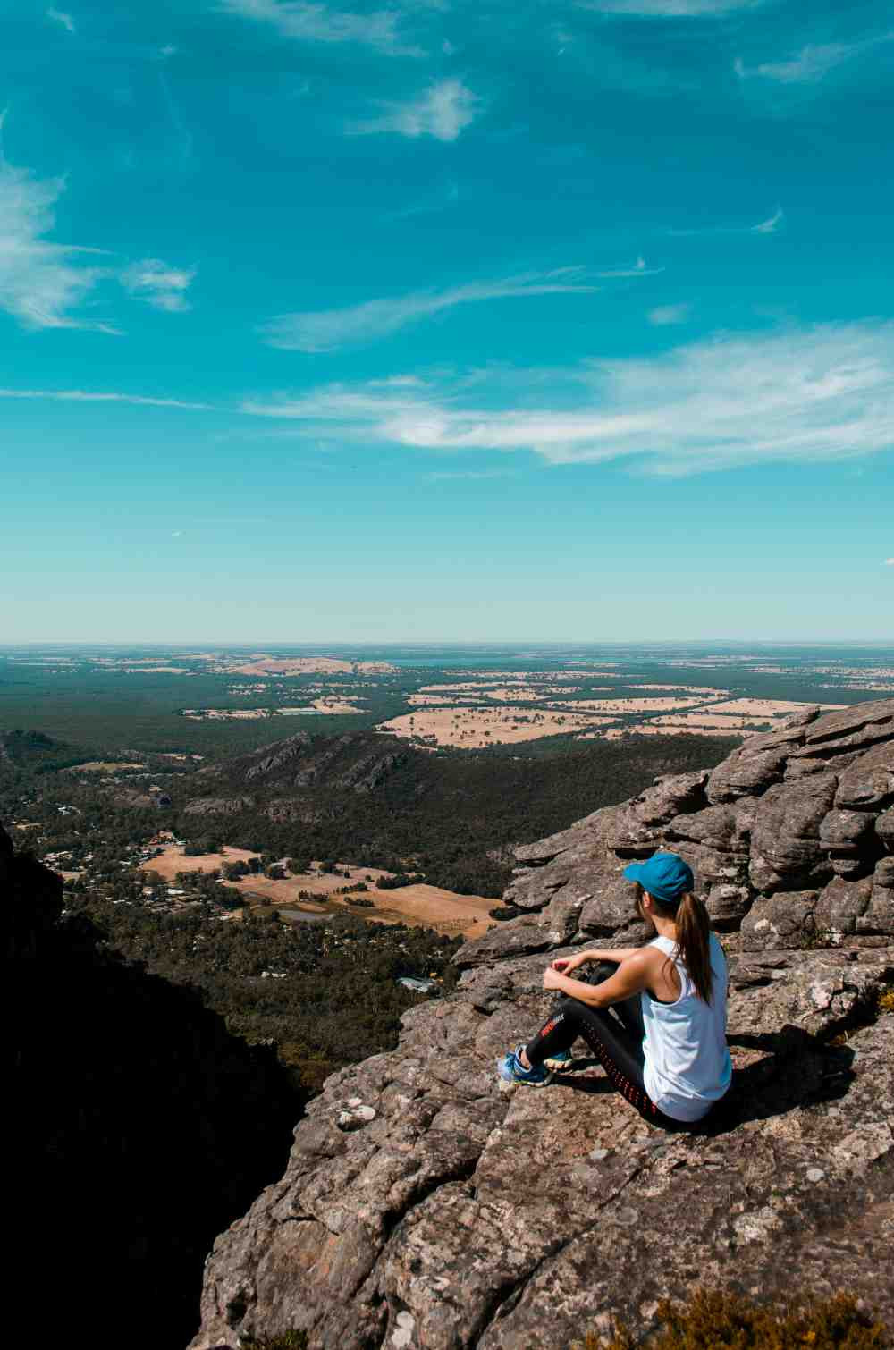 woman-sitting-on-cliff-under-blue-sky-at-daytime-linda-xu-wsl6pljq-kg-unsplash.jpg